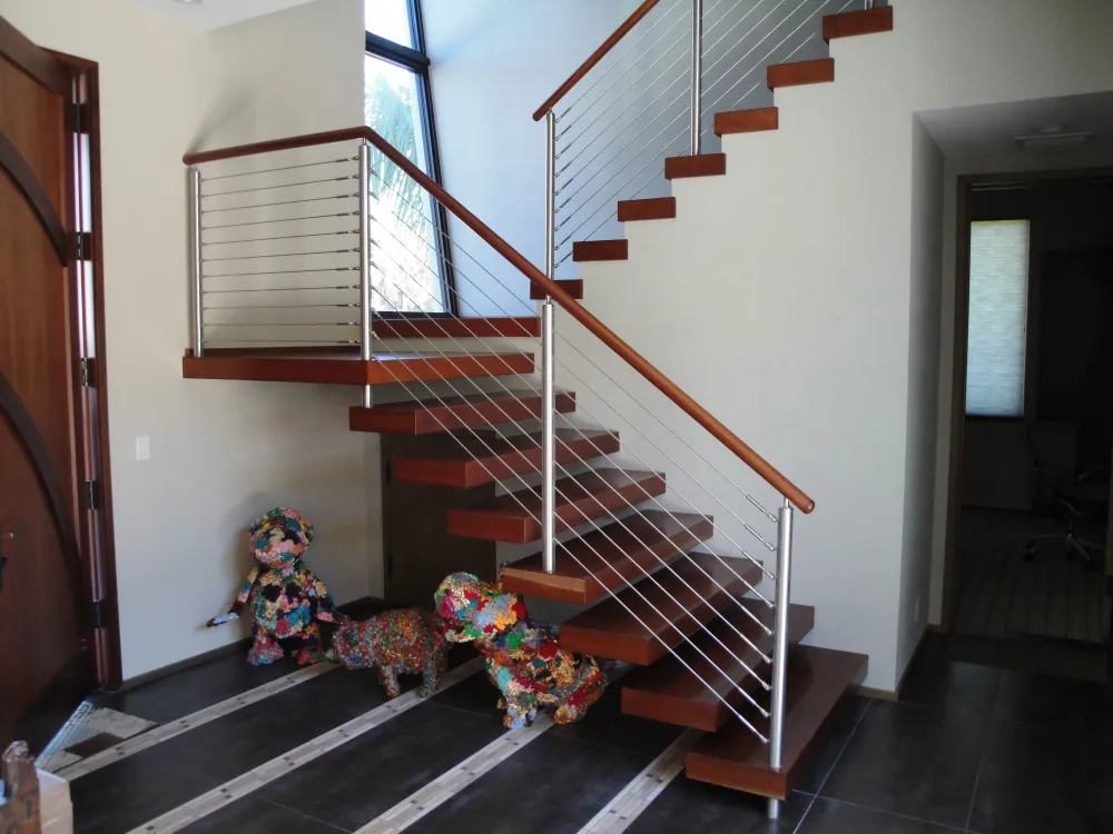 Floating hardwood treads with stainless cable railing
